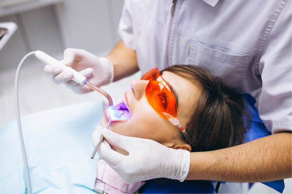 woman receiving a dental exam in Ohio