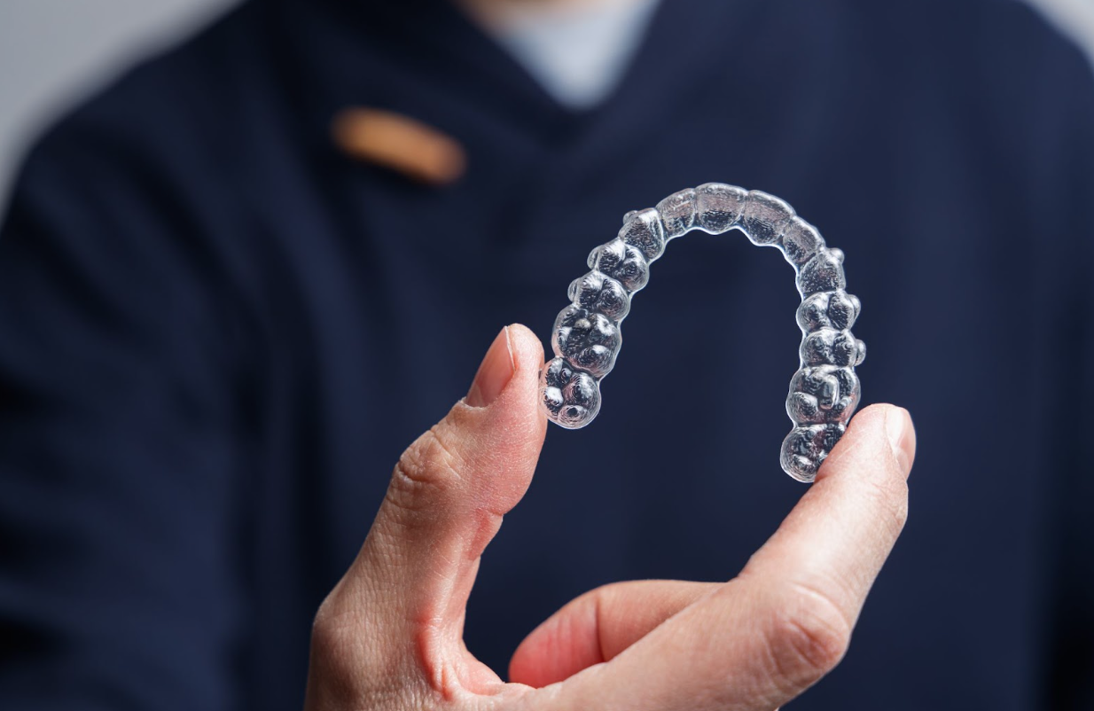 comparing clear dental brace retainers ClearCorrect vs invisalign