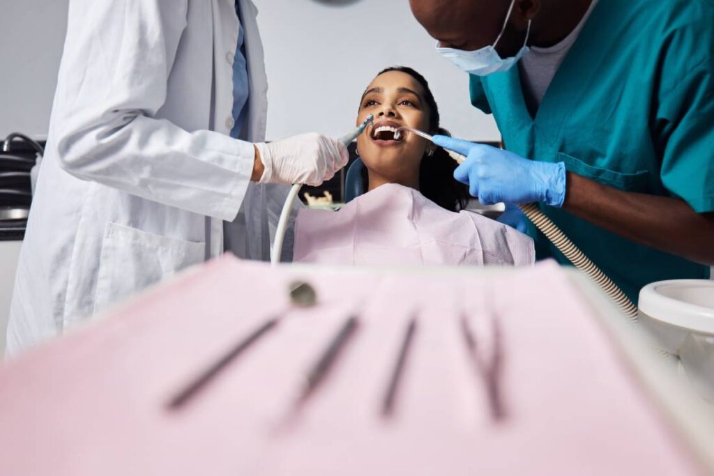 Woman shows bright smile during dental procedure