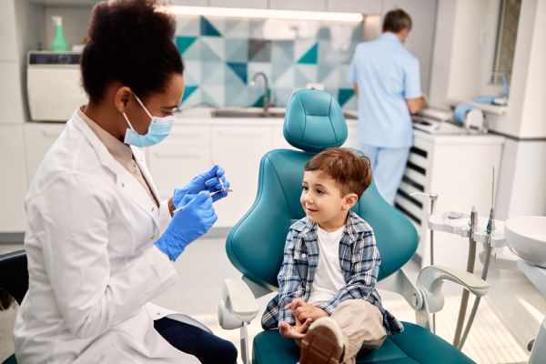 young child receiving dental exam in Ohio