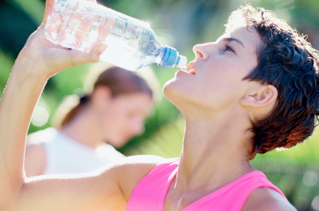 Woman drinking water from a water bottle